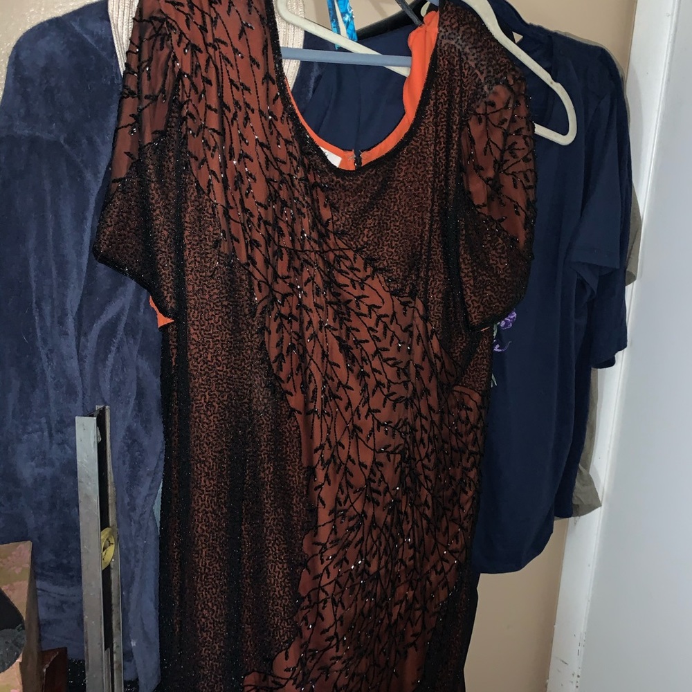 A short sleeve long dress orange with black beads